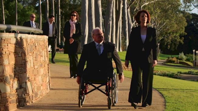 Julia Gillard visits a war memorial with Graham Edwards