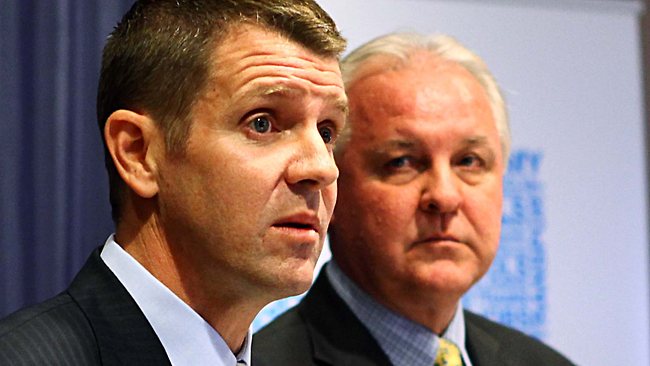 Greg Pearce looks on as Treasurer Baird is told that $1 Billion may have been found under a bar stool...