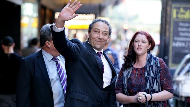 An incapicitated Bolano waves "Hi" to the good people of QBE Insurance outside the Royal Commission