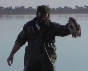 An all too familiar pose from men in cap gear and balaclavas